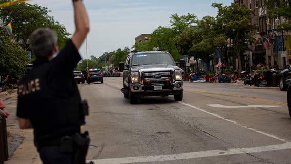 Police say parade gunman fired from rooftop as massive manhunt intensifies