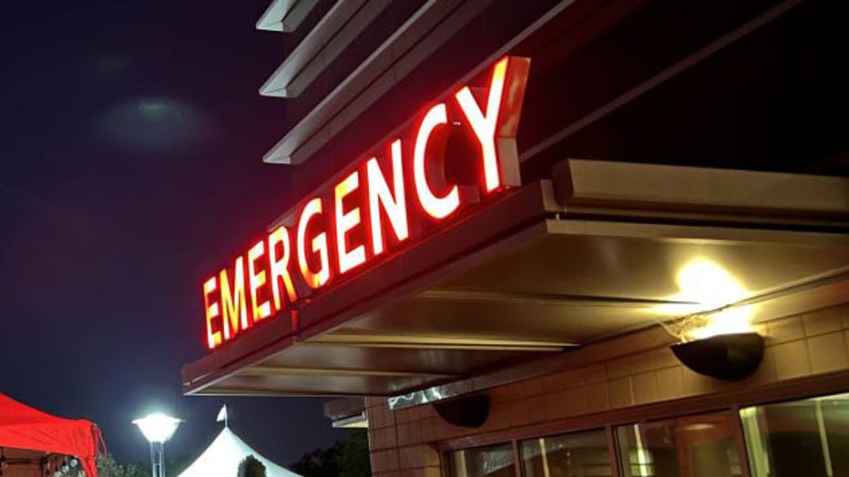 FILE IMAGE - Night view of an illuminated red sign for the emergency department or emergency room at a hospital in Walnut Creek, California, on March 15, 2022. (Photo by Gado/Getty Images)