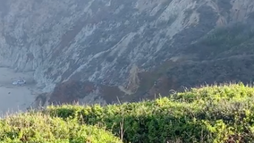 Crews race to rescue driver who went over Devil's Slide cliff