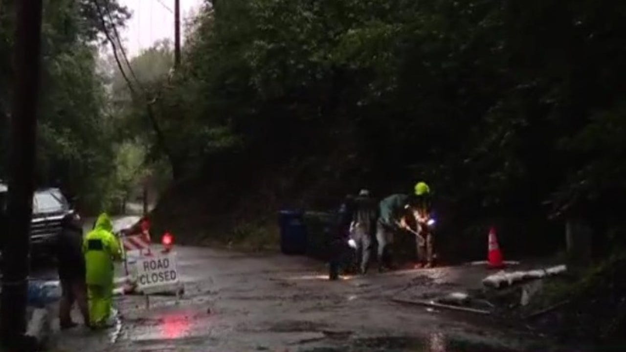 Neighbors in Santa Cruz work to save road after 30 feet deep sink