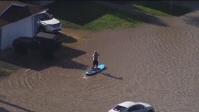 Knee-deep flooding in Livermore; residents break out the paddle boards