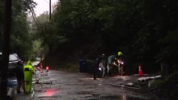 Neighbors in Santa Cruz work to save road after 30-feet deep sink hole opens up nearby