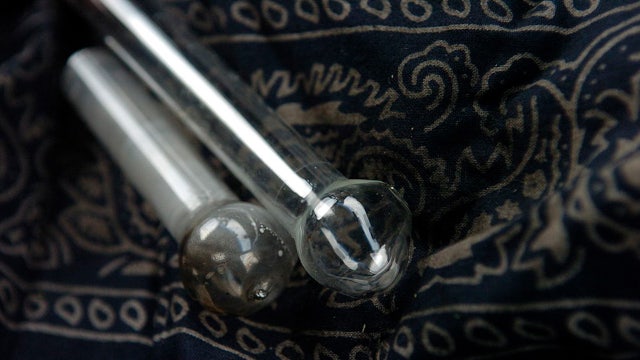 Probationer, mom arrested after deputies allegedly find drugs, loaded AR-style rifle near child