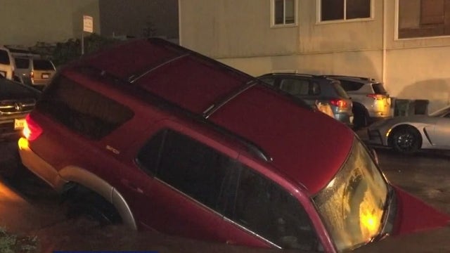 SUV nosedives into Daly City sinkhole