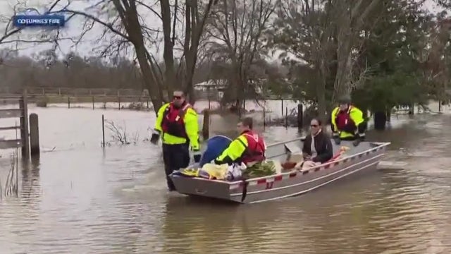 California crews rescue disabled man, wife from floods
