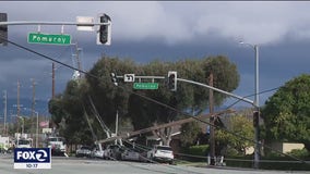 Nearly a dozen power poles toppled on Homestead Road in Santa Clara