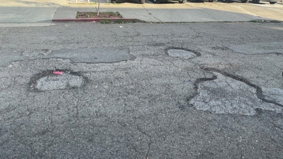 Oakland+Residents+in+Shock+as+Massive+Pothole+Devours+Family+Car