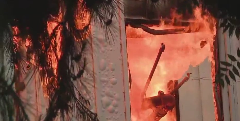 Firefighters continue to battle flames at San Jose storage facility