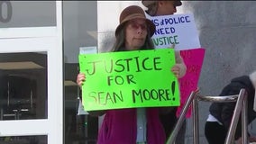 Supporters of Sean Moore protest after D.A. Jenkins drops charges against officer in fatal shooting