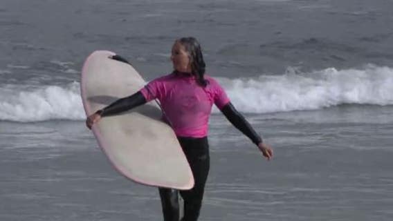 ‘The competition is pretty high’: Surfers 40 and older showcase their skills at Linda Mar Beach  