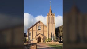 Lahaina church stands in the smoldering rubble