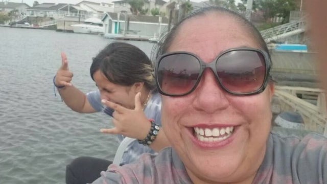 Woman who suffered medical emergency at son's football game dies