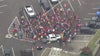 Why do striking UAW members wear red?