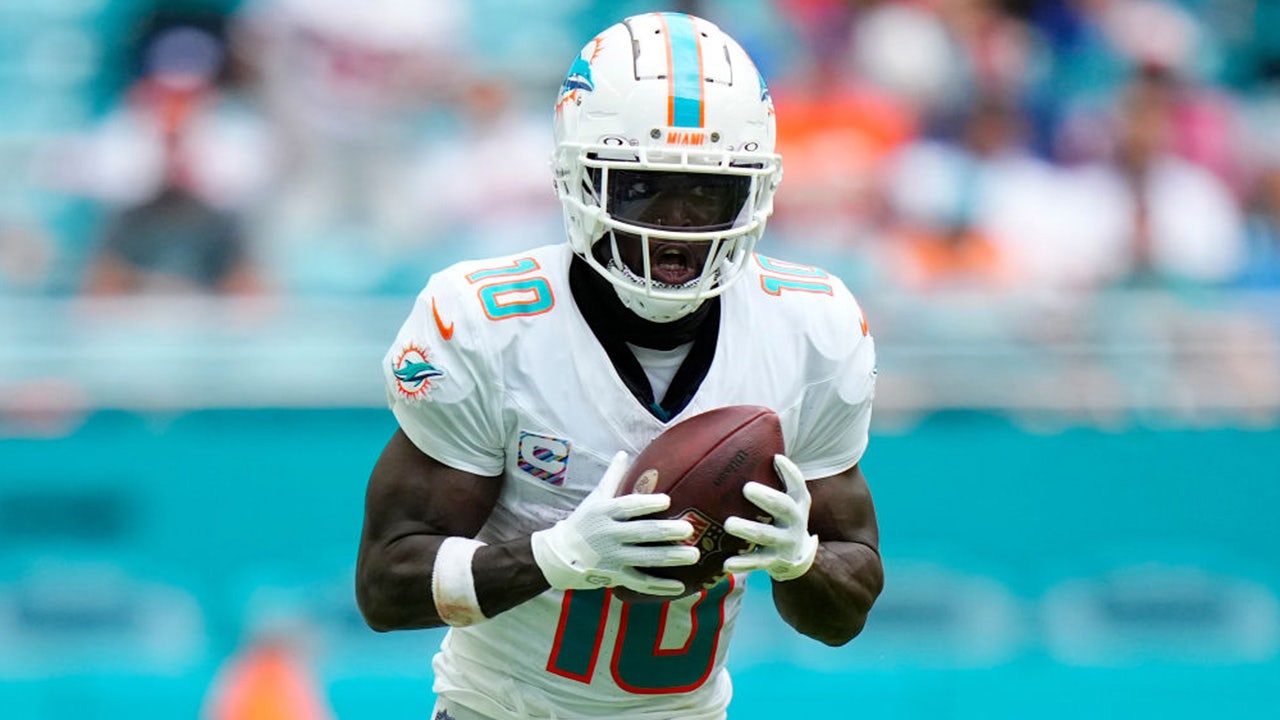 Miami Dolphins wide receiver Tyreek Hill (10) stands on the field