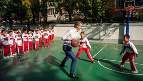 Video: Governor Newsom takes down a kid during basketball game in Beijing