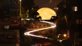 Photos: Friday's Harvest Moon framed by iconic San Francisco sites