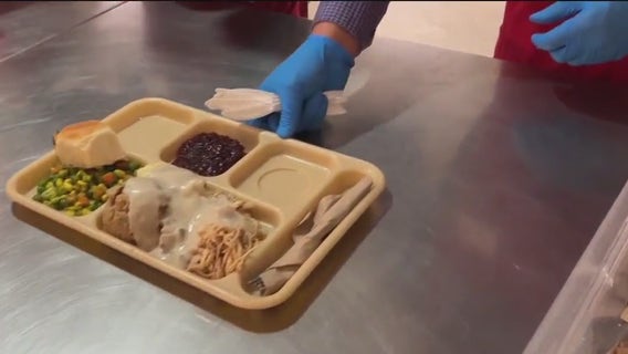 Giving away "hope for free," St. Anthony's traditional Thanksgiving feast draws crowds