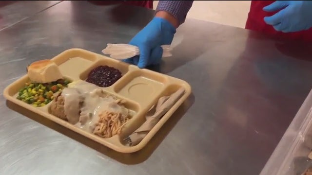 Giving away "hope for free," St. Anthony's traditional Thanksgiving feast draws crowds