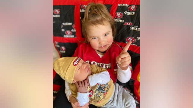 Photos: Faithful 49er fans, including babies and dogs, dress out in red and gold
