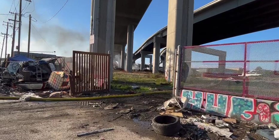 Fire starts under Oakland freeway overpasses, near Wood Street Encampment