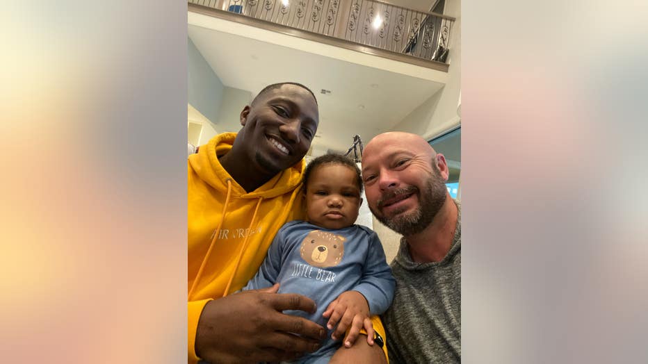 Deebo Samuel at his home with his son Deebo Samuel Jr, and Mark Hodge, Samuel's high school football coach