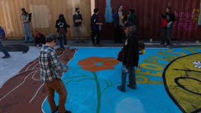 People's Park preservationists paint street mural next to cargo containers