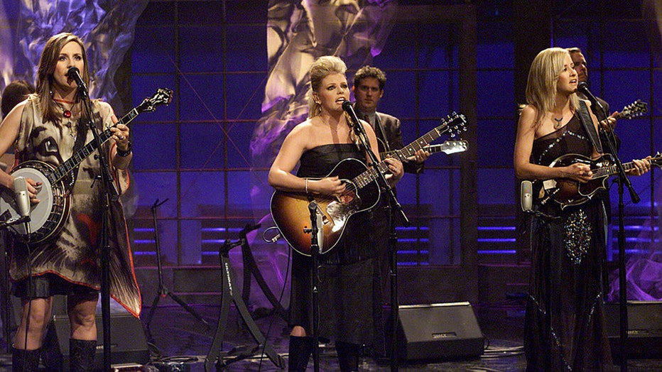 Pictured: (l-r) Emily Robison, Natalie Maines, Martie Maguire of musical guest The Dixie Chicks perform on September 5, 2002. (Photo by: Paul Drinkwater/NBCU Photo Bank/NBCUniversal via Getty Images via Getty Images)