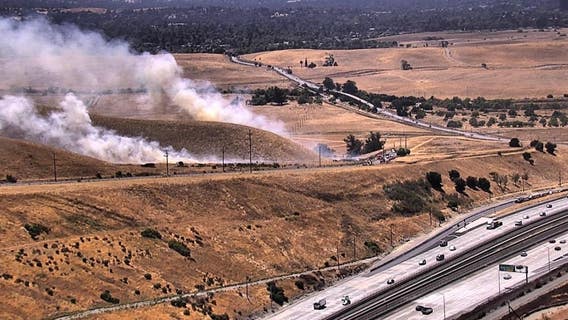 Crews battle vegetation fire near Concord