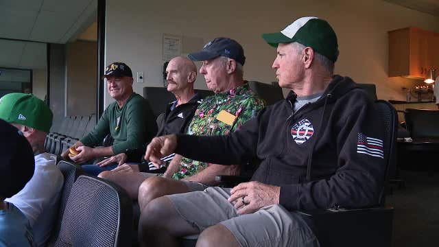 Retired firefighters watch the A's play in Oakland one last time