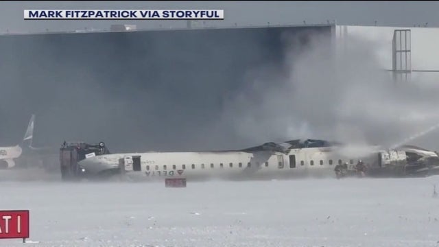 Crash video raises questions about what caused Delta plane to flip over