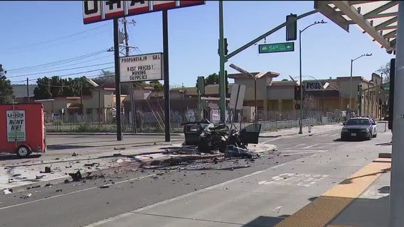 Black sedan wrapped around lamp post in Oakland; critical injury