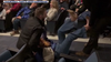 Private security guards charged after woman was dragged out of chaotic Idaho town hall meeting