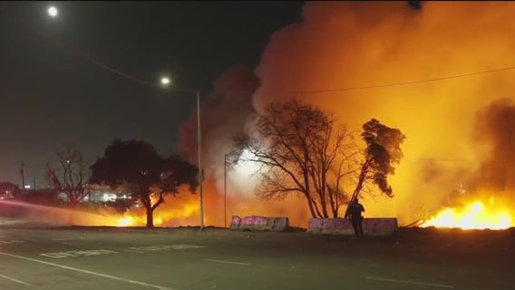 Fire sparks at East 12th Street encampment in East Oakland, after city sweeps the area