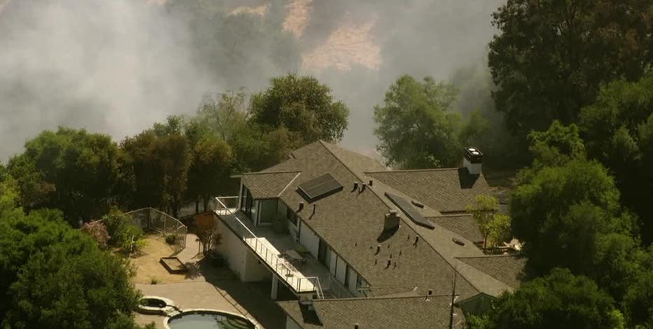 Large home momentarily threatened in Los Altos fire, 1 out building burns
