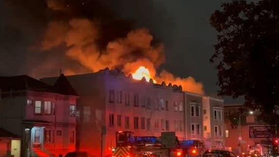 Unoccupied apartment building burning in Oakland