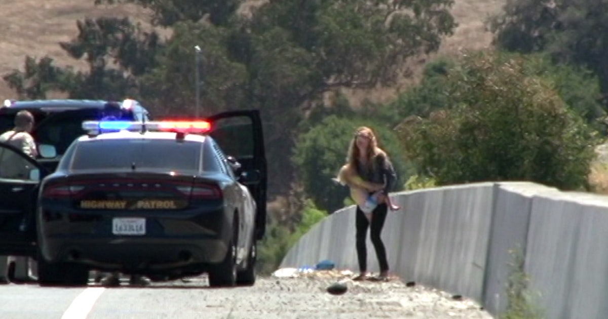 Woman arrested after driving erratically with child inside along ...