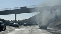 Car fire on Interstate 580 spreads to brush in Castro Valley