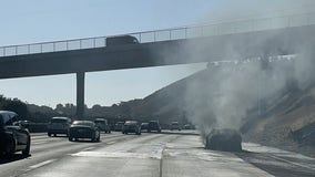 Car fire on Interstate 580 spreads to brush in Castro Valley