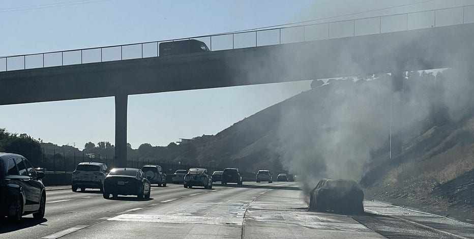 Car fire on Interstate 580 spreads to brush in Castro Valley