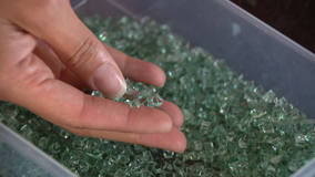 Oakland artist creates earrings from shattered car glass