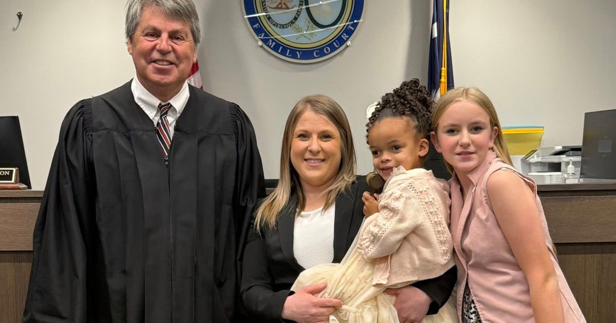 Sheriff's deputy adopts little girl she met on a 'call to protect'