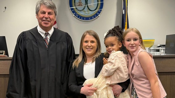 Sheriff's deputy adopts little girl she met on a 'call to protect'