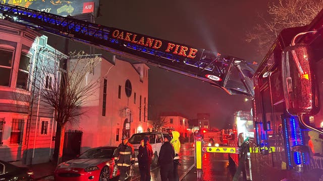 Oakland firefighters extinguish flames at 2 buildings on West Grand Ave.