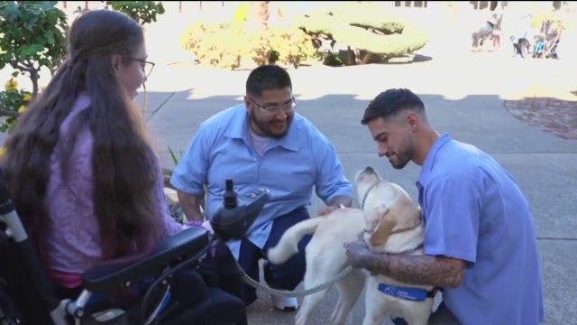 San Quentin inmates reunite with dog they trained — and meet woman service animal helps