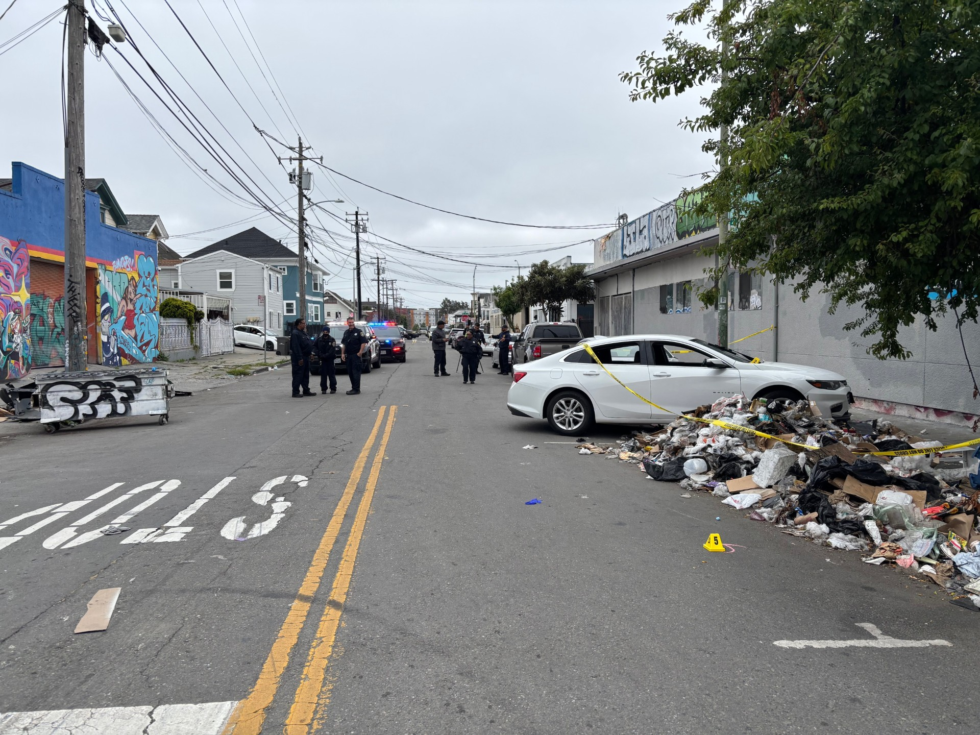 Oakland police shoot suspect after he drags officers with car, pins one