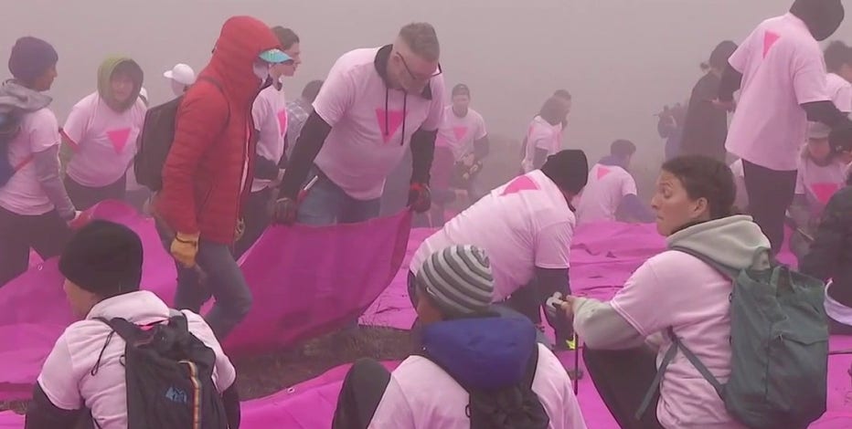 Volunteer to set up San Francisco's Pink Triangle for Pride month
