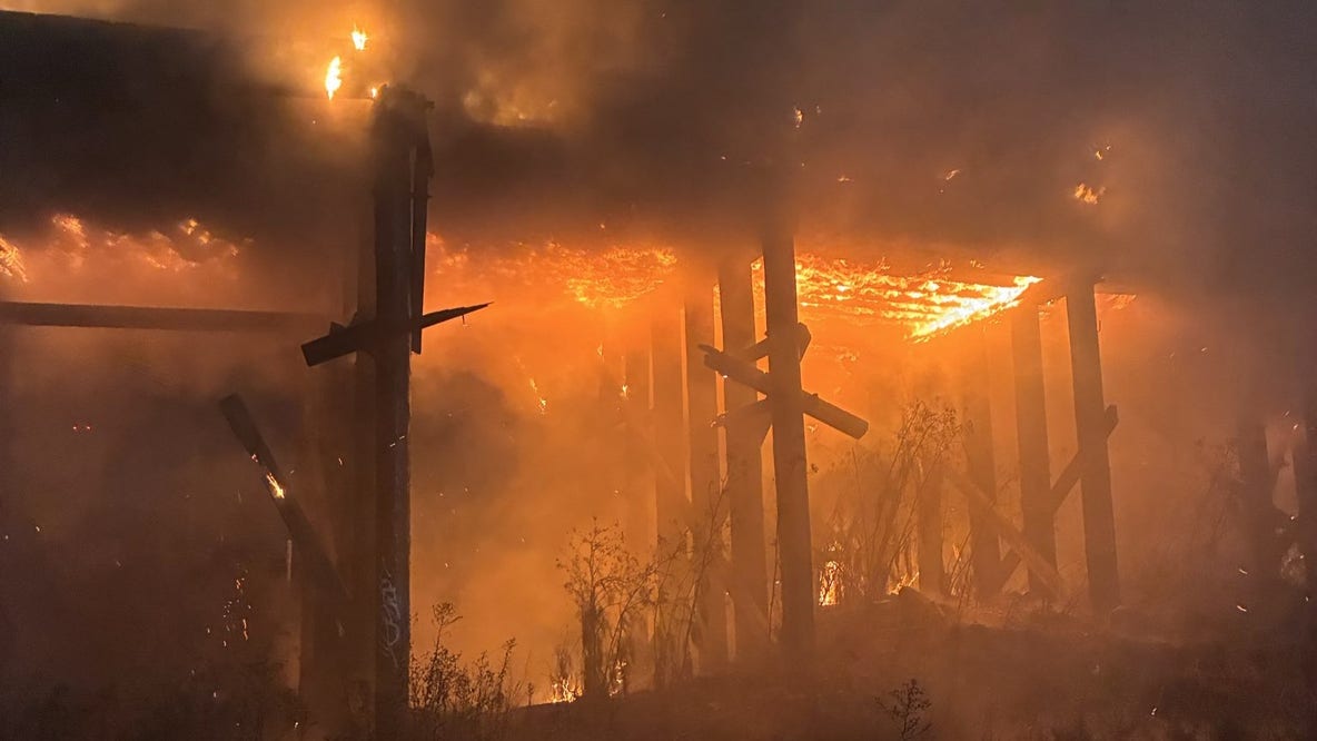 Oakland firefighters mopping up blaze that consumed abandoned train trestles near EBMUD facility