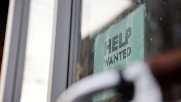 FILE - A "HELP WANTED" sign is posted at a storefront on Dec. 20, 2022. (Lance McMillan/Toronto Star via Getty Images)