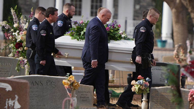 Pallbearers carry one of seven caskets of the Haight family for a graveside service and burial on Jan. 13, 2023, in La Verkin, Utah. (Photo by George Frey/Getty Images)