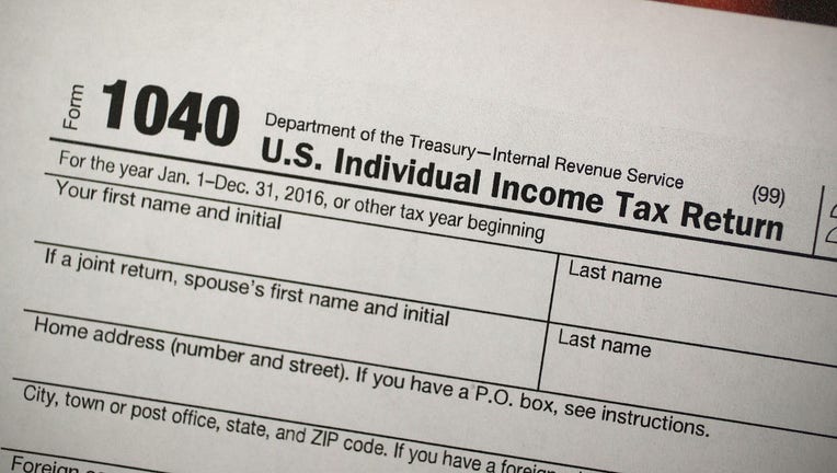 FILE IMAGE - A copy of an IRS 1040 tax form is seen on Dec. 22, 2017, in Miami, Florida. (Photo by Joe Raedle/Getty Images)
